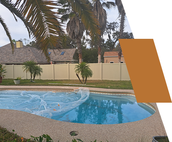 Residential backyard with a covered swimming pool, surrounded by palm trees and a beige fence under a cloudy sky. Part of the image is obscured by an orange rectangle about TrendyHiddenGems.